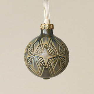Intricately carved and glazed ceramic globe ornament with ivory satin ribbon –