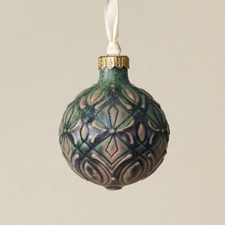 Intricately carved and glazed ceramic globe ornament with ivory satin ribbon –