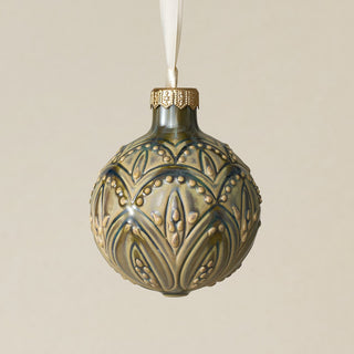 Intricately carved and glazed ceramic globe ornament with ivory satin ribbon –