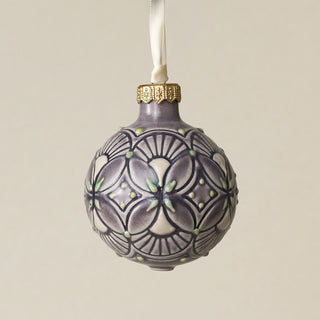 Intricately carved and glazed ceramic globe ornament with ivory satin ribbon –