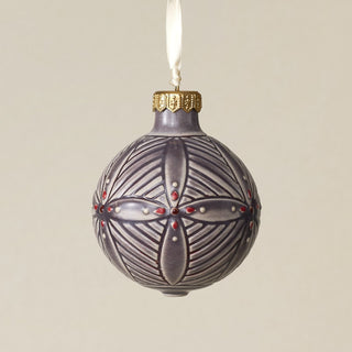 Intricately carved and glazed ceramic globe ornament with ivory satin ribbon –