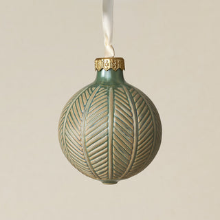 Intricately carved and glazed ceramic globe ornament with ivory satin ribbon –