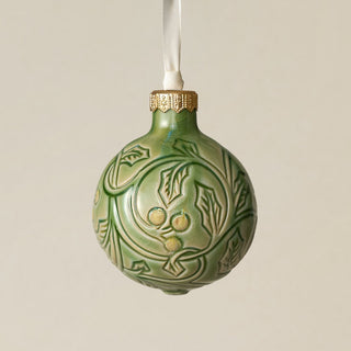 Intricately carved and glazed ceramic globe ornament with ivory satin ribbon –