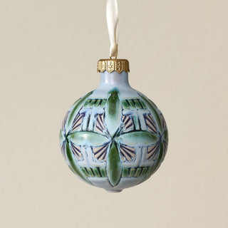 Intricately carved and glazed ceramic globe ornament with ivory satin ribbon –