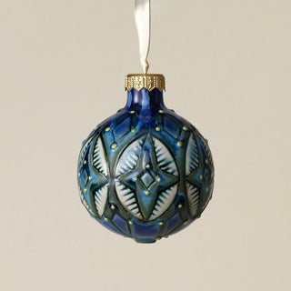 Intricately carved and glazed ceramic globe ornament with ivory satin ribbon –