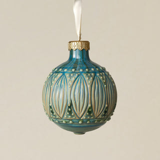 Intricately carved and glazed ceramic globe ornament with ivory satin ribbon –