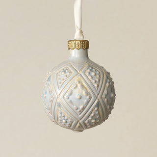 Intricately carved and glazed ceramic globe ornament with ivory satin ribbon –