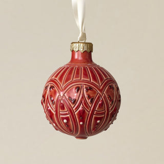 Intricately carved and glazed ceramic globe ornament with ivory satin ribbon –