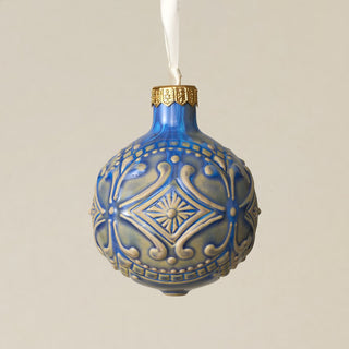 Intricately carved and glazed ceramic globe ornament with ivory satin ribbon –