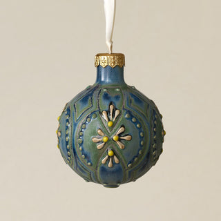 Intricately carved and glazed ceramic globe ornament with ivory satin ribbon –
