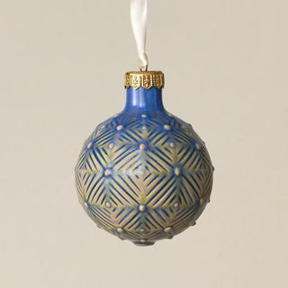 Intricately carved and glazed ceramic globe ornament with ivory satin ribbon –