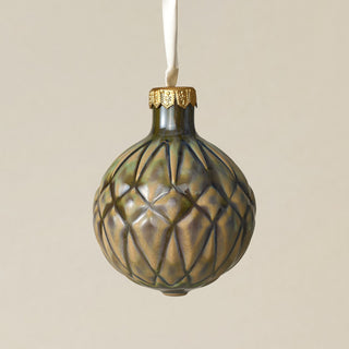 Intricately carved and glazed ceramic globe ornament with ivory satin ribbon –