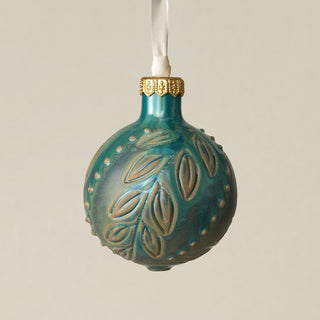 Intricately carved and glazed ceramic globe ornament with ivory satin ribbon –