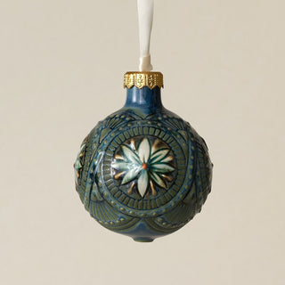 Intricately carved and glazed ceramic globe ornament with ivory satin ribbon –