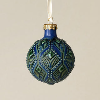 Intricately carved and glazed ceramic globe ornament with ivory satin ribbon –