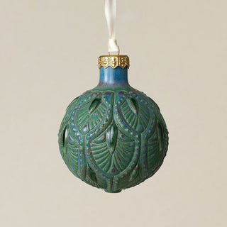 Intricately carved and glazed ceramic globe ornament with ivory satin ribbon –
