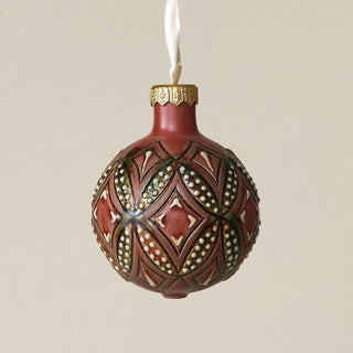 Intricately carved and glazed ceramic globe ornament with ivory satin ribbon –