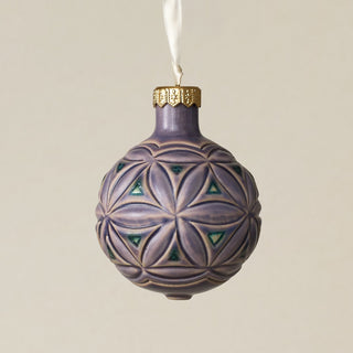 Intricately carved and glazed ceramic globe ornament with ivory satin ribbon –