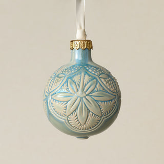 Intricately carved and glazed ceramic globe ornament with ivory satin ribbon –