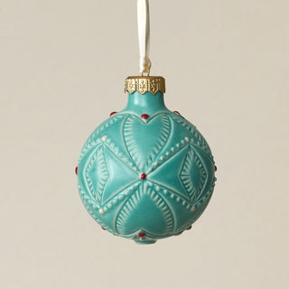Intricately carved and glazed ceramic globe ornament with ivory satin ribbon –