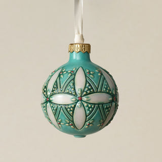 Intricately carved and glazed ceramic globe ornament with ivory satin ribbon –