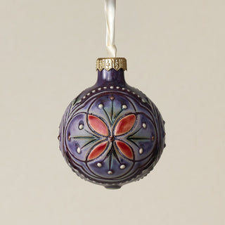 Intricately carved and glazed ceramic globe ornament with ivory satin ribbon –