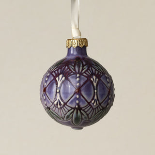 Intricately carved and glazed ceramic globe ornament with ivory satin ribbon –