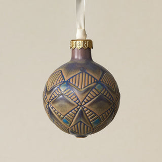 Intricately carved and glazed ceramic globe ornament with ivory satin ribbon –