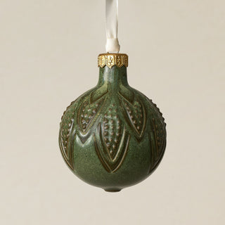 Intricately carved and glazed ceramic globe ornament with ivory satin ribbon –