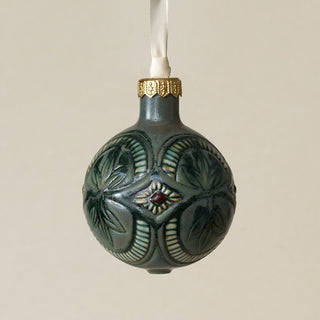 Intricately carved and glazed ceramic globe ornament with ivory satin ribbon –