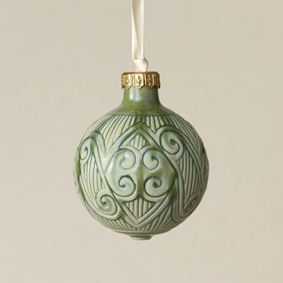 Intricately carved and glazed ceramic globe ornament with ivory satin ribbon –