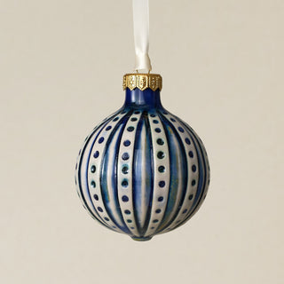 Intricately carved and glazed ceramic globe ornament with ivory satin ribbon –