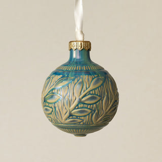 Intricately carved and glazed ceramic globe ornament with ivory satin ribbon –