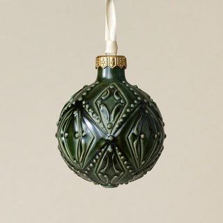 Intricately carved and glazed ceramic globe ornament with ivory satin ribbon –