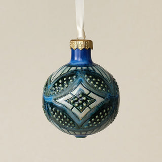 Intricately carved and glazed ceramic globe ornament with ivory satin ribbon –