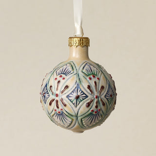 Intricately carved and glazed ceramic globe ornament with ivory satin ribbon –