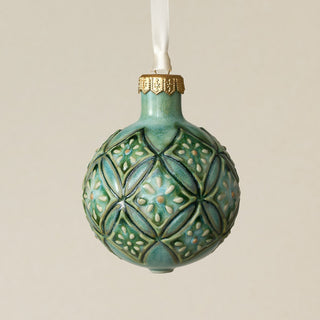 Intricately carved and glazed ceramic globe ornament with ivory satin ribbon –