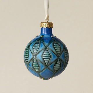 Intricately carved and glazed ceramic globe ornament with ivory satin ribbon –