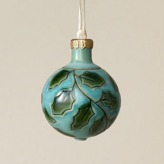 Intricately carved and glazed ceramic globe ornament with ivory satin ribbon –