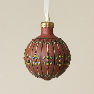 Intricately carved and glazed ceramic globe ornament with ivory satin ribbon –