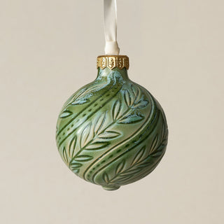 Intricately carved and glazed ceramic globe ornament with ivory satin ribbon –