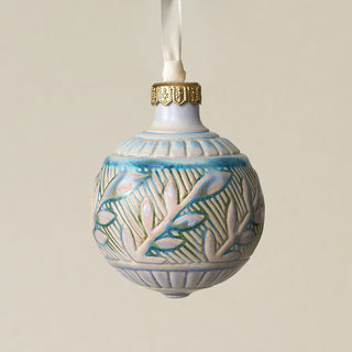 Intricately carved and glazed ceramic globe ornament with ivory satin ribbon –