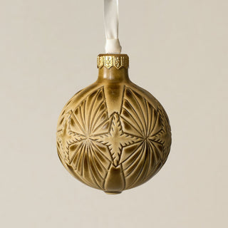 Intricately carved and glazed ceramic globe ornament with ivory satin ribbon –