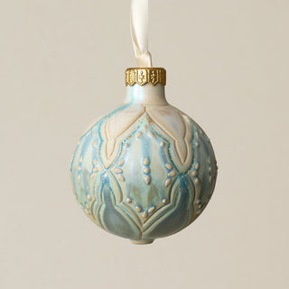 Intricately carved and glazed ceramic globe ornament with ivory satin ribbon –