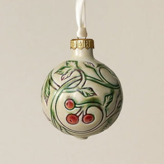 Intricately carved and glazed ceramic globe ornament with ivory satin ribbon –