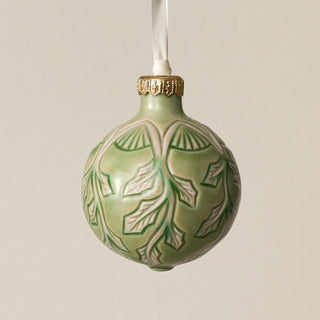 Intricately carved and glazed ceramic globe ornament with ivory satin ribbon –