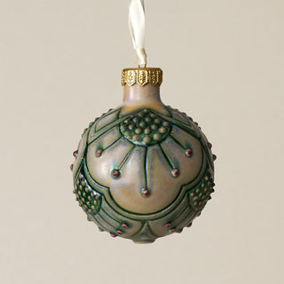 Intricately carved and glazed ceramic globe ornament with ivory satin ribbon –