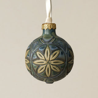 Intricately carved and glazed ceramic globe ornament with ivory satin ribbon –
