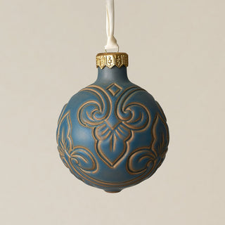 Intricately carved and glazed ceramic globe ornament with ivory satin ribbon –