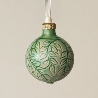 Intricately carved and glazed ceramic globe ornament with ivory satin ribbon –